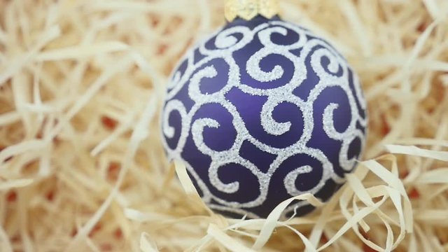 Purple ball on wood chips background
