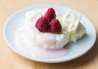 Cottage cheese in plate with berries