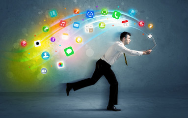 Fototapeta na wymiar Running businessman with application icons from device