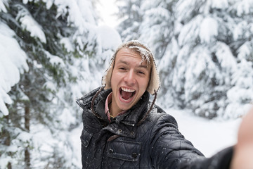 Young Man Smile Camera Taking Selfie Photo In Winter Snow Forest Guy Outdoors Walking White Park