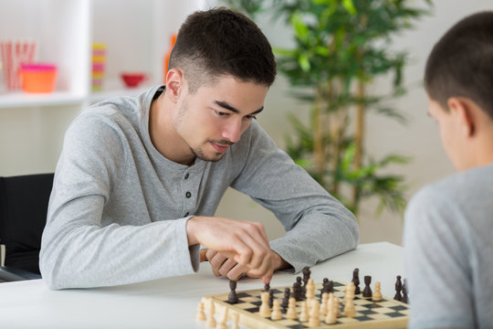 two students playing chess