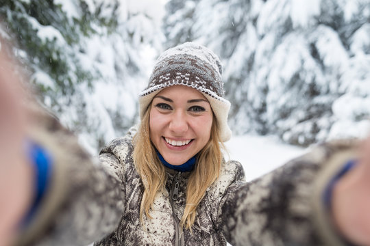 Young Beautiful Woman Smile Camera Taking Selfie Photo In Winter Snow Forest Girl Outdoors Walking White Park