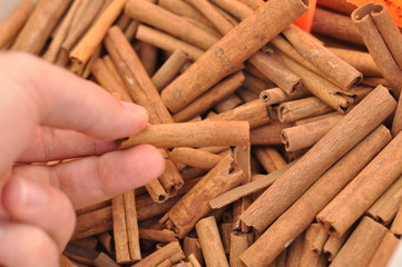 Cinnamon sticks close up at farmer's market. Background. Texture of cinnamon sticks. Top view.