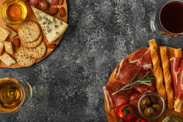 Cheese and meat appetizer selection, top view.