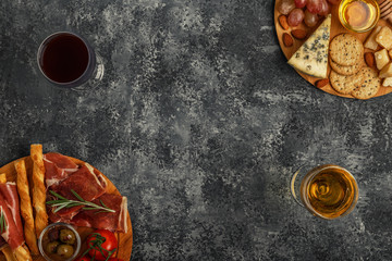 Cheese and meat appetizer selection, top view.