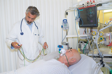 senior doctor with his sick patient