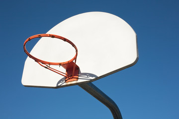 Outdoor basketball hoop with no net.
