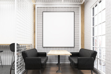 Cafe interior with grate and black sofas