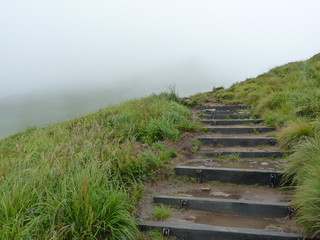 Foggy mountains. The trail in the fog. Beautiful landscape rainy clouds moody weather scenic background. Bieszczady mountains, Poland