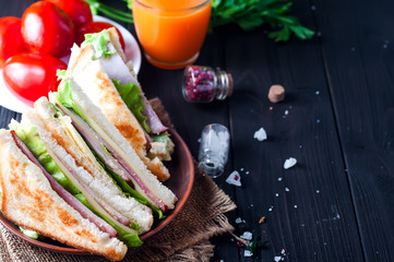 homemade sandwich with salad and juice as a healthy breakfast