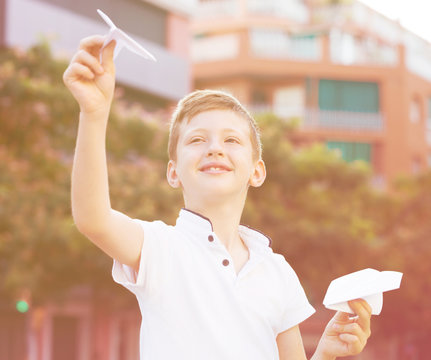 Boy Throwing Paper Plane