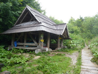 Shelter in the mountains. Foggy mountains. The trail in the fog. Beautiful landscape rainy clouds moody weather scenic background. Bieszczady mountains, Poland