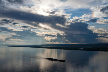 Barge floating along the big river. Lena river. Yakutia. Russia.