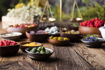 Assorted natural medical herbs and mortar