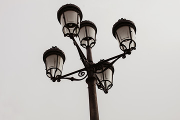 Black streetlight with five lamps
