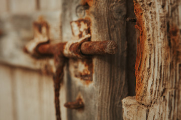 Closed rusty on an wooden door