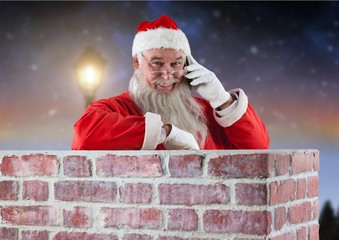 Santa claus inside a chimney talking on mobile phone