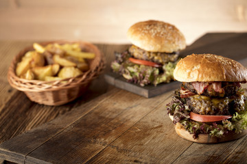 Fresh home-made hamburger served on wood, place for typography
