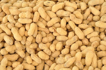 Raw peanuts at a farmer's market, texture background top view