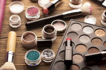 Make up artist theme. Various makeup products. Top view. Set of professional cosmetic: make-up brushes, shadows, lipstick. Place for typography and logo.