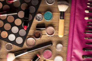 Make up artist theme. Various makeup products. Top view. Set of professional cosmetic: make-up brushes, shadows, lipstick. Place for typography and logo.