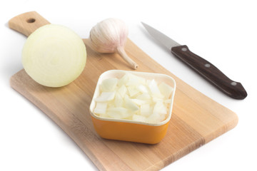 Diced Onions. Onions in cubes over a wooden board