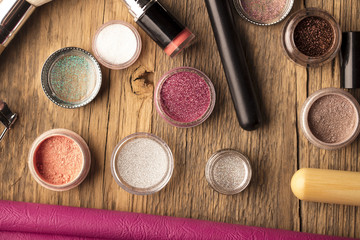 Make up artist theme. Various makeup products. Top view. Set of professional cosmetic: make-up brushes, shadows, lipstick. Place for typography and logo.