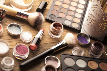 Make up artist theme. Various makeup products. Top view. Set of professional cosmetic: make-up brushes, shadows, lipstick. Place for typography and logo.