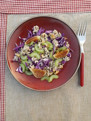 Vegetarian salad of boiled barley with vegetables and figs