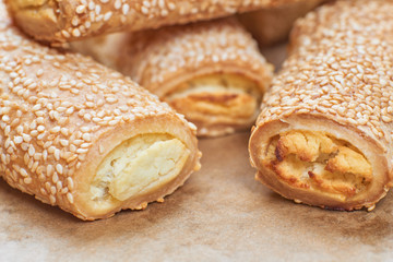 Homemade appetizers with cheese fillings. Cakes sprinkled with s