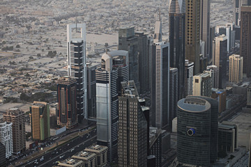 Fototapeta na wymiar Dubai panorama, aerial view. Modern architecture concept. Beautiful aerial shot of Dubai . Main highway to Abu Dhabi. Sunset. Tallest buildings in the world. Sunset. Architecture concept.
