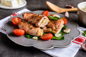 Roasted turkey breasts stuffed with Camembert, served with rice