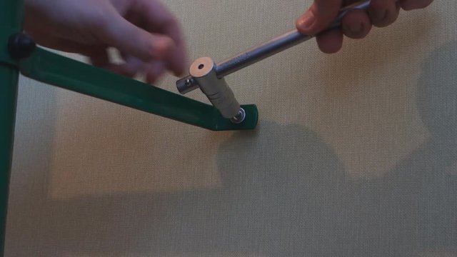 hand spins into the wall screw wrench