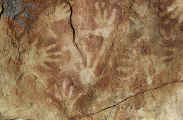 Handprints on rock