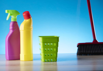 Variety of cleaning products,home work, on blue background