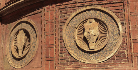 old face of a building in Milan, Italy