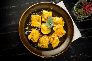 filled Italian pasta plate simple clean handmade ravioli parmesan cheese rustic plain dish lunch dinner