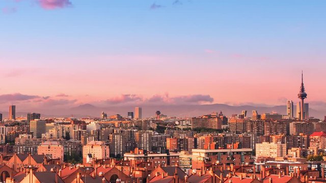 timelapse of madrid city skyline cityscape from day to night panning