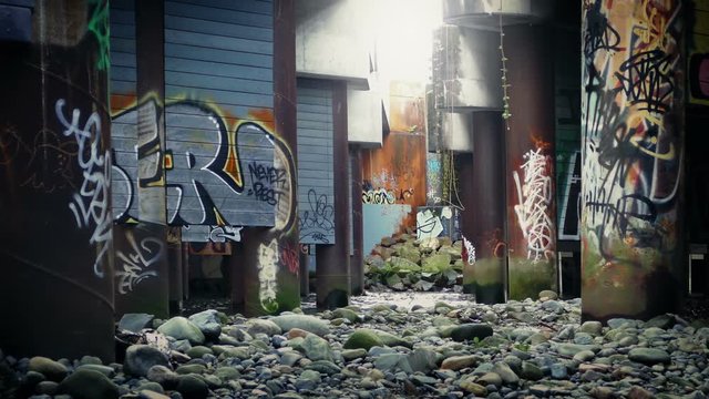 Passing Through Industrial Area With Graffiti