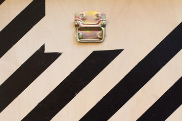 wooden cargo container door detail with black stripes