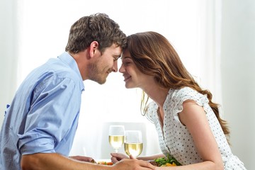 Romantic couple holding wineglasses