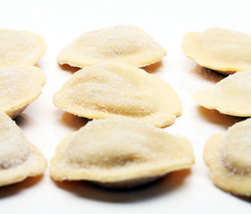 Fettuccine and spaghetti with ingredients for cooking pasta on a white background, top view. Flat lay