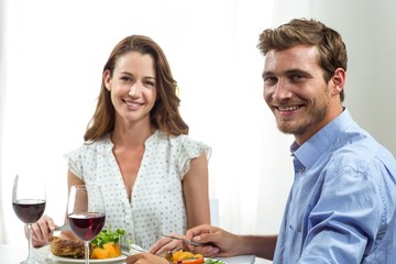 Obraz na płótnie Canvas Portrait of happy couple having lunch