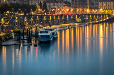 Turin (Torino) scenic view on Murazzi and River Po at twilight