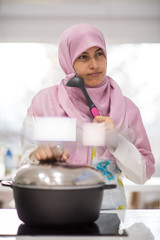 Arabic beautiful housewife making a lunch in kitchen