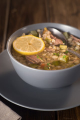 Meat soup with lemon, wine and bread