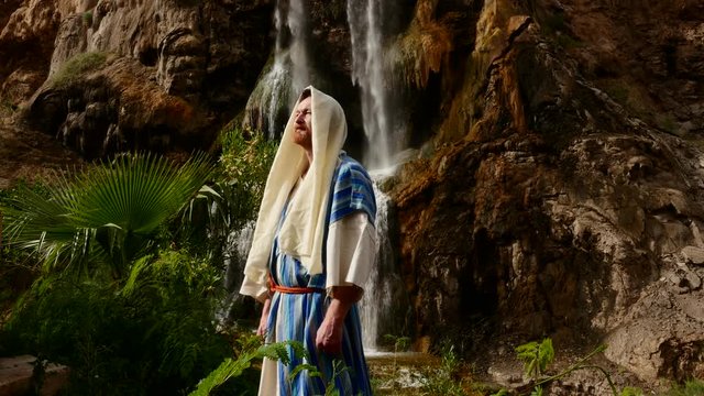 Exalted Jewish Man Pharisee Near Waterfall Worshiper Folds His Hands Going to Commit the Ritual of Ablution Scripture-Containing Case is on His Forehead