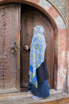 Muslim traditional woman visiting old historical city