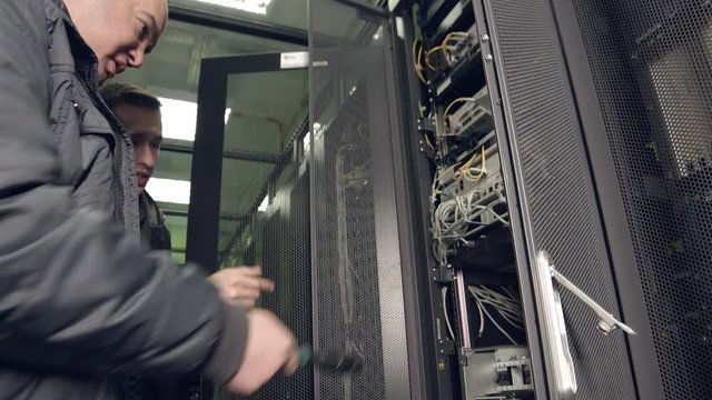 Two Employees Discuss a Solution to the Problem in the Server Room