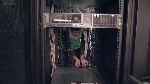 Worker Install the Equipment in a Server Rack